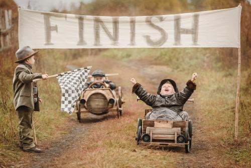 Children racing toy cars