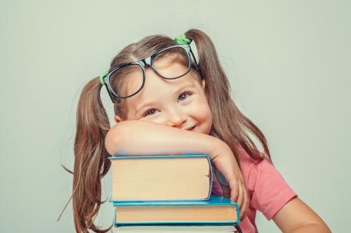 Laughing girl with books
